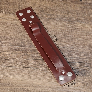 Brown wide leather punk bracelet for men with silver studs on dark wood background