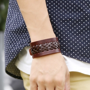 Handmade woven wide brown leather bracelet for men featuring vintage wrap design style