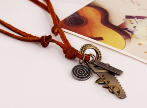Close-up of retro leather necklace with antique bronze pendants and rustic design