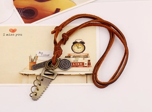 Detail view of retro leather rope necklace with engraved metal tags and saw blade pendant