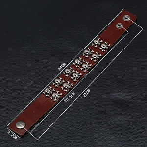 Men's punk leather bracelet with double row silver skulls and snap button closure