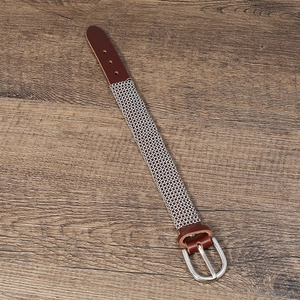Punk style brown leather and silver chain watch band with metal buckle on wood background