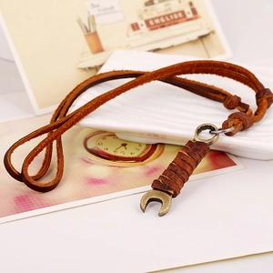 Retro alloy wrench pendant necklace with dark brown leather cord in a vintage punk style