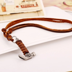 Vintage leather necklace with silver hammer pendant and skull relief in punk style