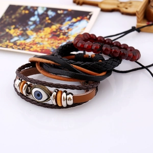 Vintage layered leather bracelet set for men featuring a blue evil eye bead and wood accents