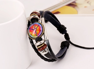Detail of multi-layer leather bracelet with colorful peace symbol charm and wooden beads