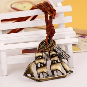 Retro sailboat pendant necklace in bronze finish with adjustable brown leather cord