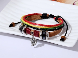 Detail of multi-layer woven leather bracelet with hollow leaf pendant and colorful beads