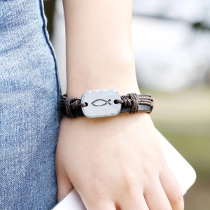 Vintage woven leather bracelet with silver fish charm and adjustable cord for men