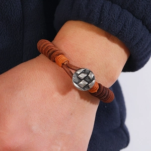Men's vintage hand-woven brown leather bracelet with silver textured metal clasp