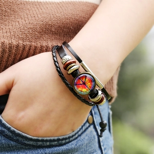 Multilayer leather beaded bracelet featuring a peace sign glass charm for a boho style