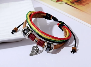 Detail of multi-layer woven leather bracelet with leaf pendant and adjustable cord