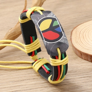 Handmade leather bracelet with colorful Peace Sign and Jamaican red yellow green weaving