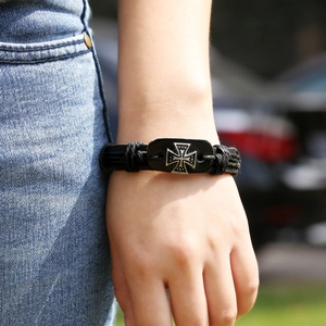 Vintage woven leather bracelet with silver iron cross charm and adjustable pull cord