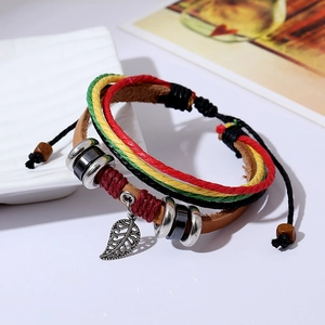 Bohemian multi-layer braided leather bracelet with hollow leaf pendant on white background