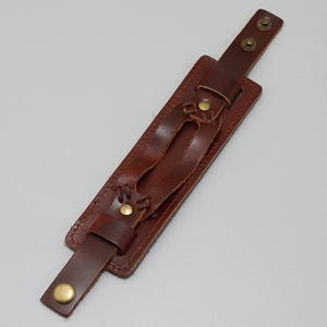 Vintage brown multi-layer wide leather cuff bracelet with bronze snap fasteners and stitching