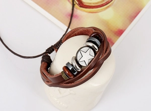 Detail of multi-layer braided leather bracelet with star metal charm and wooden beads