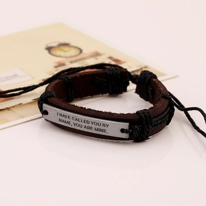 Vintage leather bracelet with engraved metal plate featuring inspirational quote