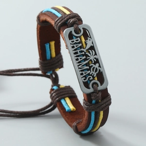 Handmade leather Bahamas bracelet with nautical dolphin and palm tree metal plaque