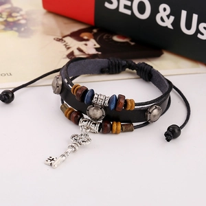 Punk style multilayer leather bracelet with wooden beads and vintage silver key charm