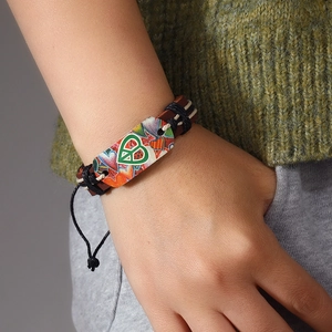 Adjustable hand-woven leather bracelet with colorful heart and peace sign plate charm