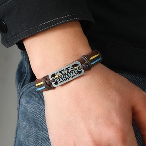 Handwoven brown leather bracelet featuring engraved Bahamas silver plaque with tropical icons