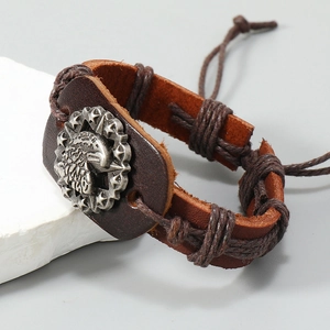 Handwoven brown leather bracelet for men featuring a vintage eagle crest on stone base