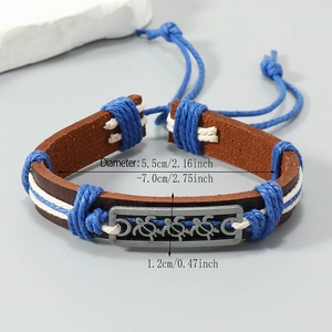Handmade leather turtle bracelet with blue braided rope and metal turtle charm on stone