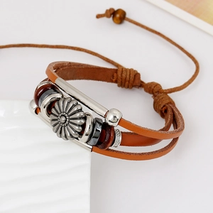 Multilayer genuine leather bracelet with silver daisy charm and beads on white background
