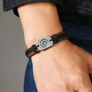 Bohemian men's brown leather braided bracelet with spiral engraved antique silver charm