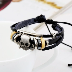Handmade leather multi-layer woven bracelet with silver skull charm and wooden beads