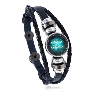 Detail of woven leather Aquarius bracelet with star-themed glass gem and metal beads