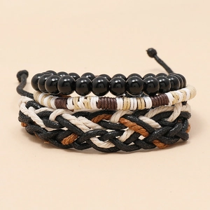 Detailed view of three-piece men's braided rope and bead bracelet set in retro style