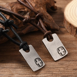 Retro cross pendant necklace in black and brown leather cord with distressed metal finish