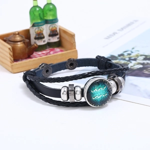 Detail of multi-layer leather bracelet with Aquarius constellation charm and metal beads