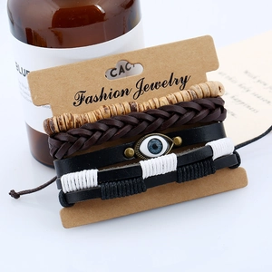 Detail of four-piece retro braided leather bracelet set with Evil Eye and wood beads