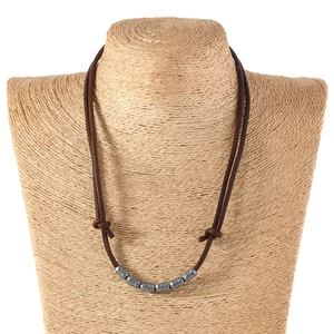 Vintage adjustable brown leather cord necklace featuring seven textured silver metal beads