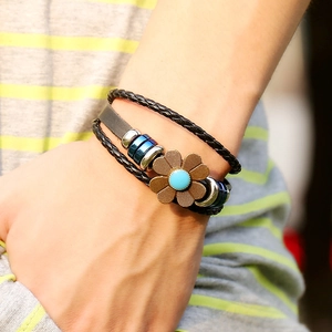 Multilayer vintage punk leather bracelet with a bronze flower and blue bead accent
