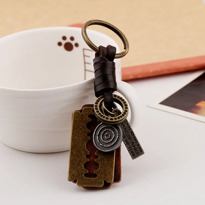 Retro leather woven keychain with vintage razor blade charm and engraved metal tag