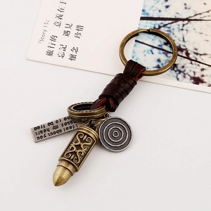 Vintage woven leather keychain with antique bronze bullet pendant and metal tags