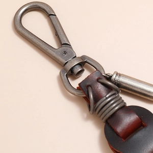 Vintage brown leather keychain with bronze lobster clasp for men in industrial retro style