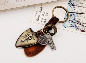 Retro punk woven leather keychain with bronze cross pendant and engraved quote tag