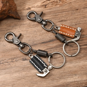 Punk style handmade leather hammer pendant keychain with skull motif in black and brown