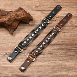 Macro detail of punk leather bracelets with metal star studs and chain edge decoration