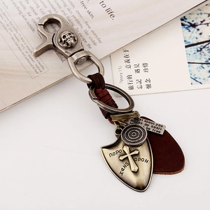 Vintage leather keychain with metal skull carabiner and shield pendant charms