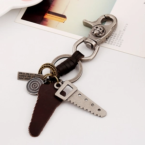 Vintage braided leather keychain with skull clasp, engraved tag and saw blade charm