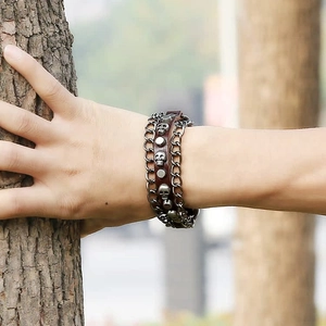 Retro punk leather multi-layer bracelet with metal skull and studs on wrist