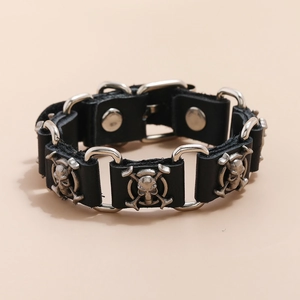 Punk black leather bracelet featuring silver metal skull studs and connector rings