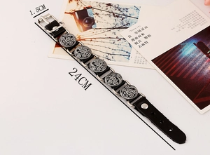 Detail view of 24cm vintage black leather punk bracelet with silver floral metal studs
