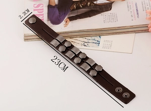 Detail view showing 2.2cm width and 23cm length of punk rivet leather bracelet